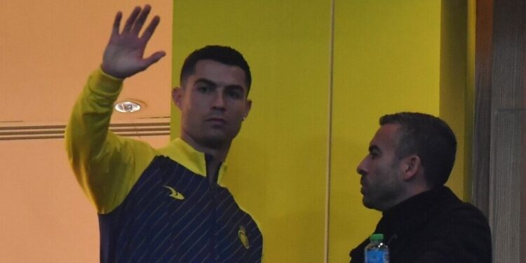 Nassr's Portuguese forward Cristiano Ronaldo watches from the VIP area ahead of the Saudi Pro League football match between Al-Nassr and At-Tai at the Mrsool Park Stadium in the Saudi capital Riyadh on January 6, 2023. (Photo by AFP)