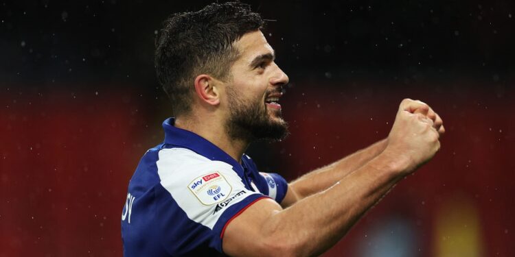 WATFORD, ENGLAND - DECEMBER 12: Sam Morsy of Ipswich Town celebrates with the fans after the team's victory during the Sky Bet Championship match between Watford and Ipswich Town at Vicarage Road on December 12, 2023 in Watford, England. (Photo by Richard Heathcote/Getty Images)
