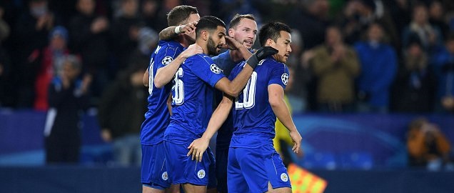 Leicester City's Algerian midfielder Riyad Mahrez (2L) celebrates scoring his team's second goal from the penalty spot, with Leicester City's English midfielder Danny Drinkwater (2R) and Leicester City's Japanese striker Shinji Okazaki (R) during the UEFA Champions League group G football match between Leicester City and Club Brugge at the King Power Stadium in Leicester, central England on November 22, 2016. / AFP PHOTO / Paul ELLISPAUL ELLIS/AFP/Getty Images