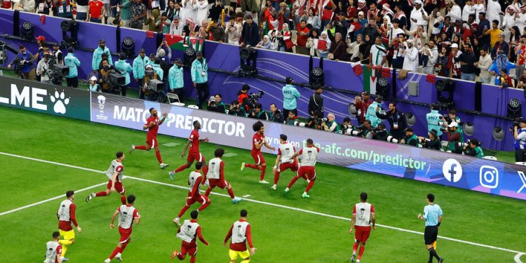 Soccer Football - AFC Asian Cup - Final - Jordan v Qatar - Lusail Stadium, Lusail, Qatar - February 10, 2024 Qatar's Akram Afif celebrates scoring their third goal with teammates and completing his hat-trick REUTERS/Rula Rouhana