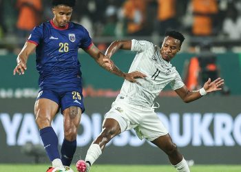 Cape Verde's midfielder #26 Kevin Pina (L) fights for the ball with South Africa's forward #11 Themba Zwane during the Africa Cup of Nations (CAN) 2024 quarter-final football match between Cape Verde and South Africa at the Stade Charles Konan Banny in Yamoussoukro on February 3, 2024. (Photo by FRANCK FIFE / AFP)