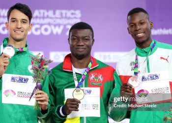 GLASGOW, SCOTLAND - MARCH 03: Silver medallist Yasser Mohammed Triki of Team Algeria, gold medallist Hugues Fabrice Zango of Team Burkina Faso and bronze medallist Tiago Pereira of Team Portugal pose for a photo during the medal ceremony for the Men's Triple Jump Final on Day Three of the World Athletics Indoor Championships Glasgow 2024 at Emirates Arena on March 03, 2024 in Glasgow, Scotland. (Photo by Michael Steele/Getty Images)