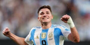 Argentina's forward #09 Julian Alvarez celebrates scoring his team's first goal during the Conmebol 2024 Copa America tournament semi-final football match between Argentina and Canada at MetLife Stadium, in East Rutherford, New Jersey on July 9, 2024. (Photo by CHARLY TRIBALLEAU / AFP)